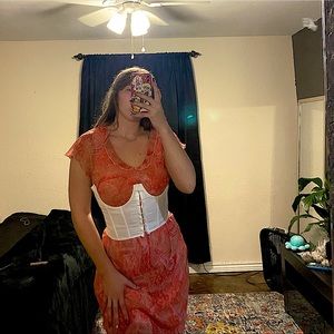 Antique over the knee dress. Styled with a white corset to make it more fitting.